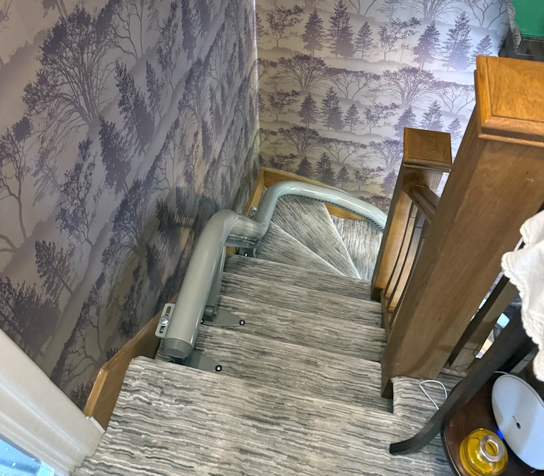 Flow X navigating complex curved staircase with multiple bends