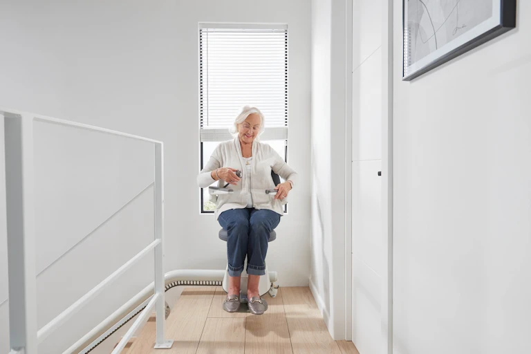 Flow X curved stairlift swivel seat at landing